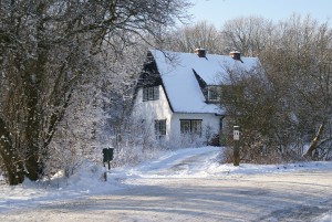 an image of a house shrouded in winter